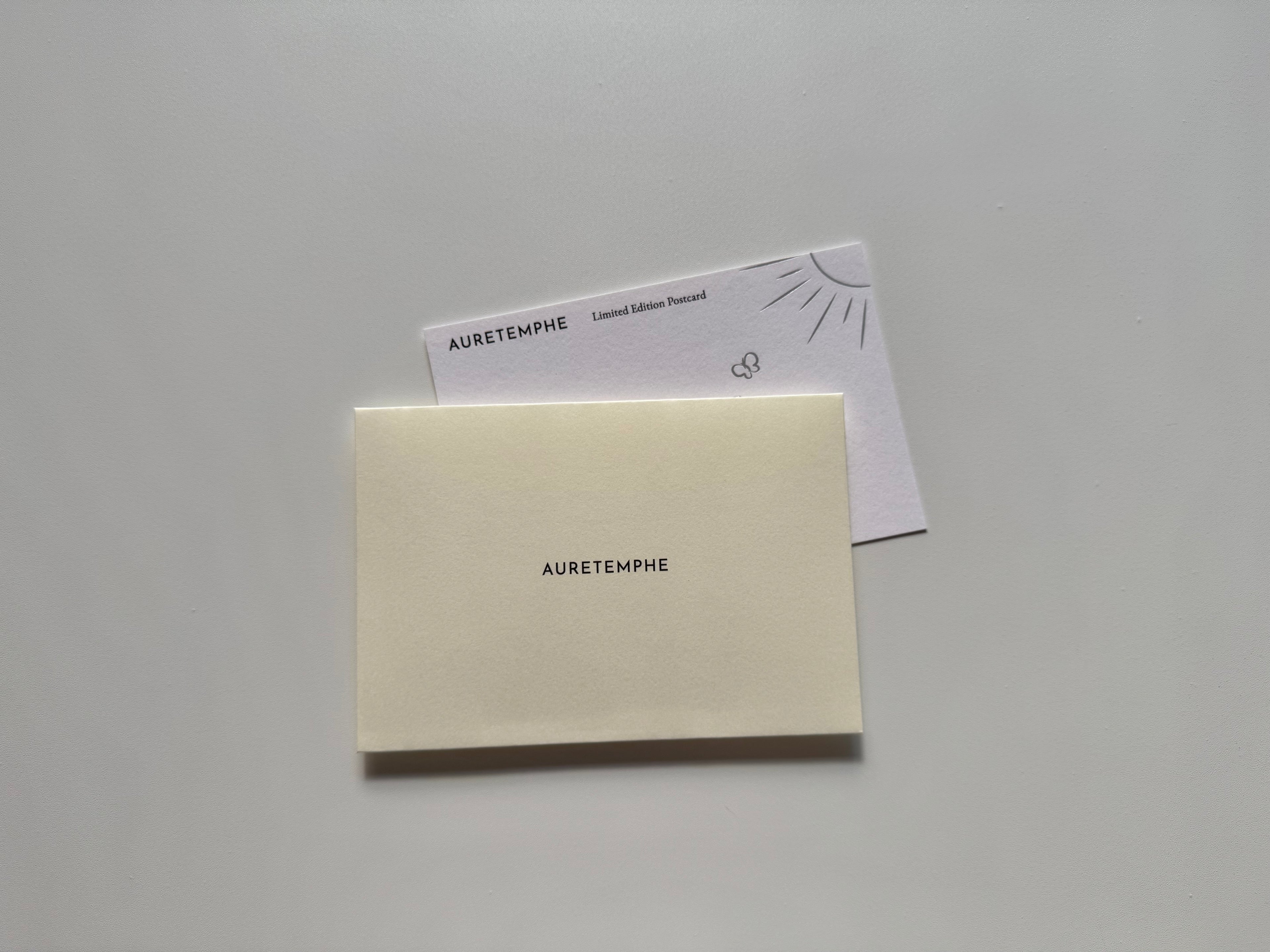Detail of AURETEMPHE envelope and postcard made from FSC-certified paper.