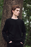 AURETEMPHE lon sleeve t-shirt in black organic cotton, unisex fit, shown on male model.
