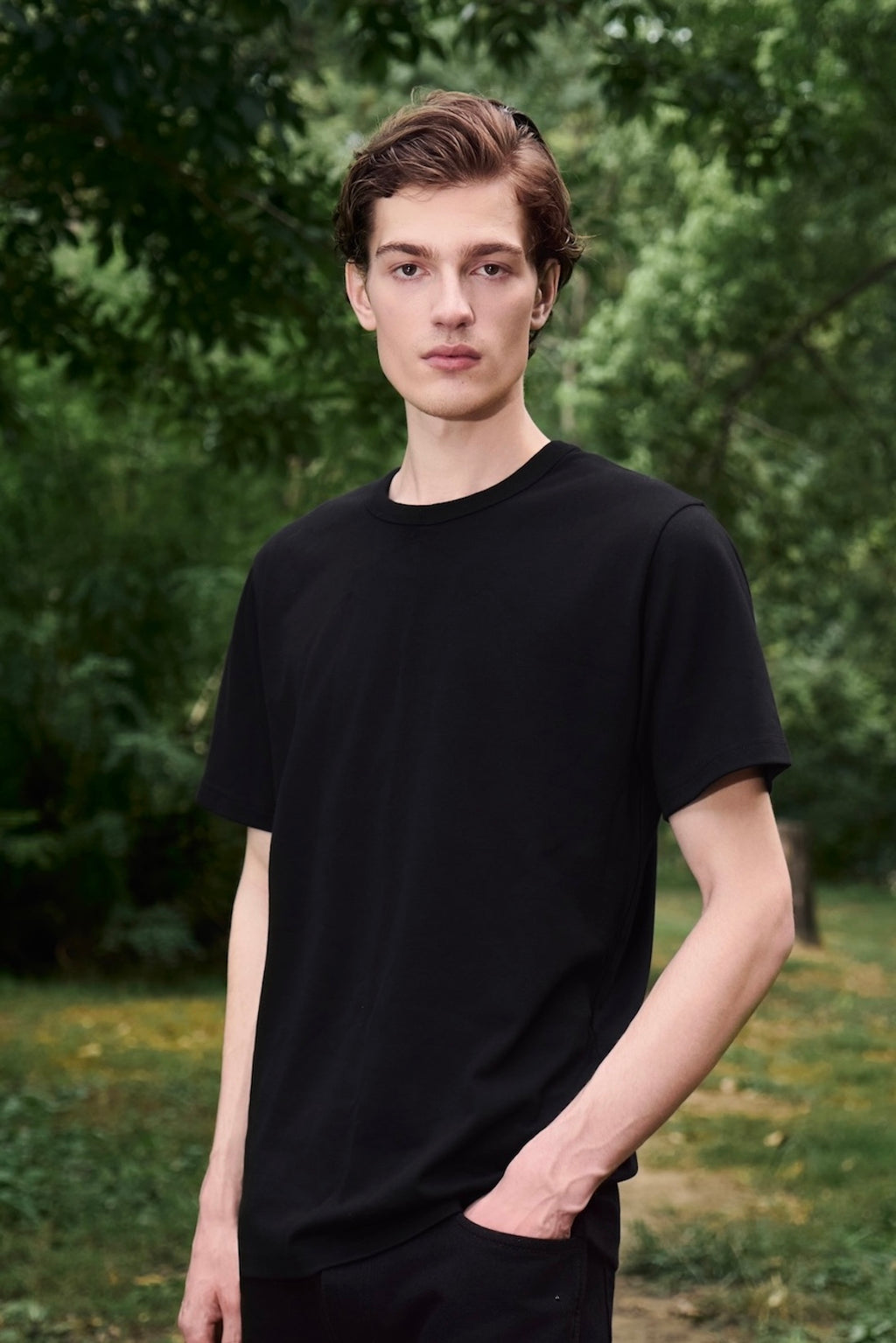 AURETEMPHE short sleeve t-shirt in black organic cotton, unisex fit, shown on male model.