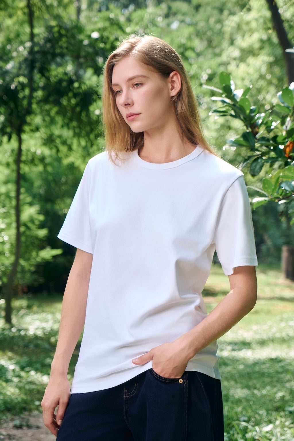 AURETEMPHE short sleeve t-shirt in white organic cotton, unisex fit, shown on female model.