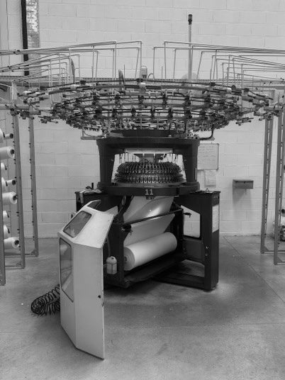 Detail of Portuguese craftsmanship: AURETEMPHE fabric being woven on a loom in the workshop.